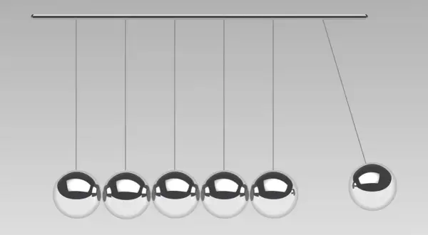 Newtonsche Gesetz: Pendel mit fünf Kugeln, die eine Kugel in Bewegung setzen.